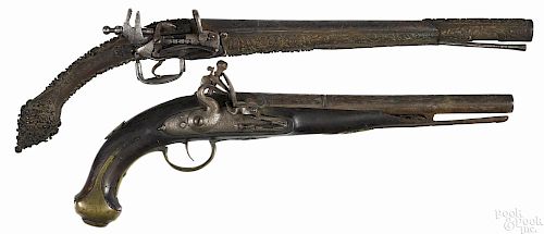 Two Middle Eastern flintlock pistols, to include one approximately .60 caliber