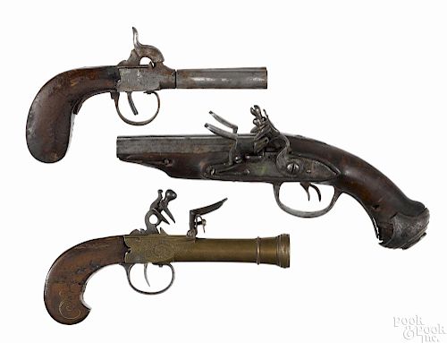 Two double barrel and a single barrel black powder pistols, to include a European flintlock