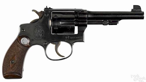 Smith & Wesson kit gun six-shot revolver, .22 caliber, with walnut grips and a 4'' round barrel.