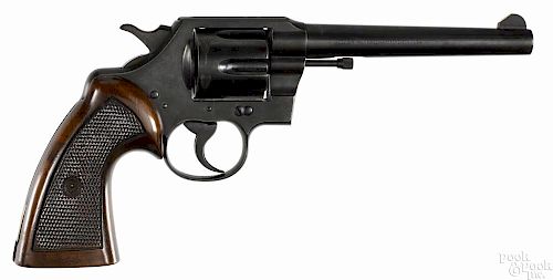 Colt Official Police six-shot revolver, .38 special caliber, with extended walnut target grips