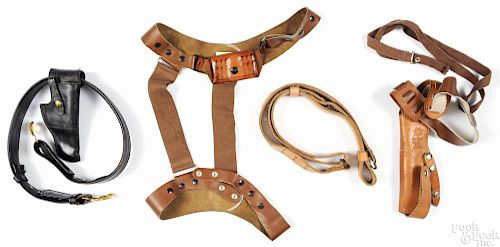 Three holsters and belts, to include a black leather US Army General Officer's belt