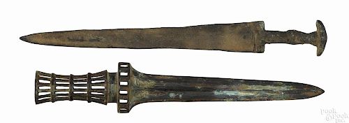 Two excavated bronze daggers, 15 1/4'' l. and 16'' l.