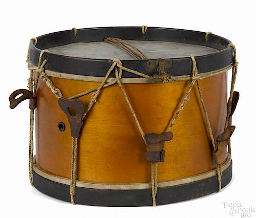 Civil War era snare drum with leather rope tighteners, a maple body, and heavily patinated bands