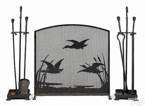 Wrought iron fireplace screen, andirons, and fire tools, early 20th c.