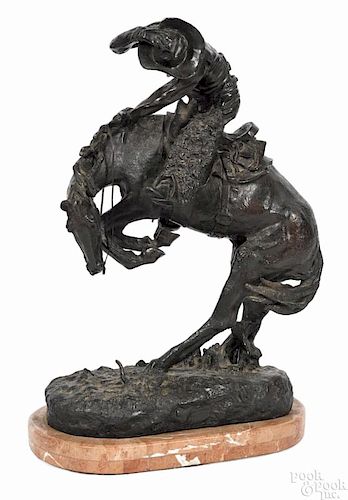 After Frederic Remington, bronze ''Bronc Buster'' sculpture with an oval marble base, 24 1/2'' h.