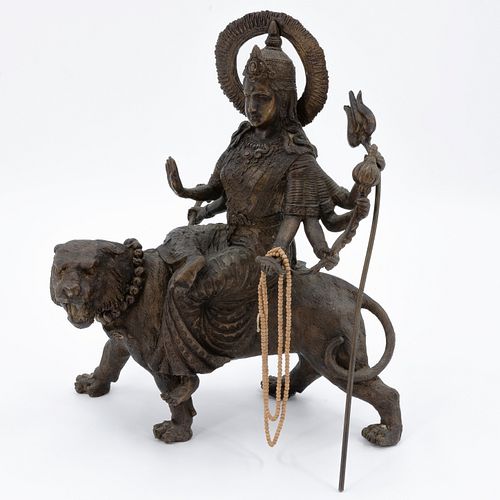 Patinaed Metal Figure of a Deity on a Tiger