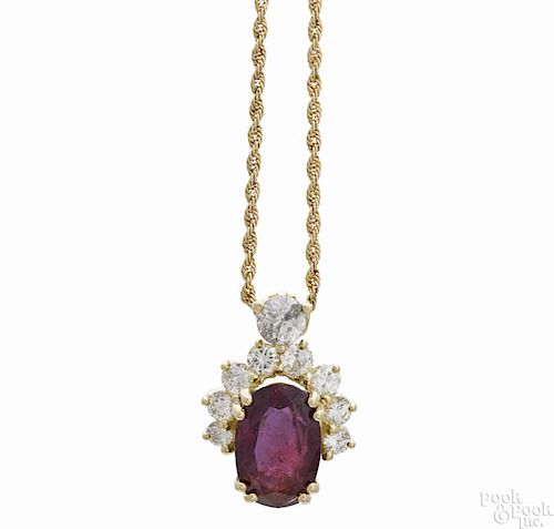 Gold, ruby, and diamond necklace, the pendant with an 18K yellow gold setting