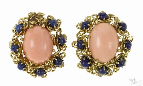18K yellow gold, coral, and lapis clip earrings, each set with a central coral cabochon