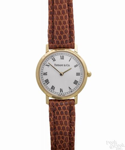 Tiffany & Co. ladies wrist watch with a Tiffany lizard strap and an 18K yellow gold case