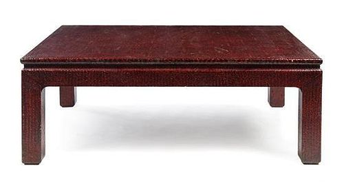 Attributed to Karl Springer (German, 1931-1991), CIRCA 1970s, a red lacquered low table