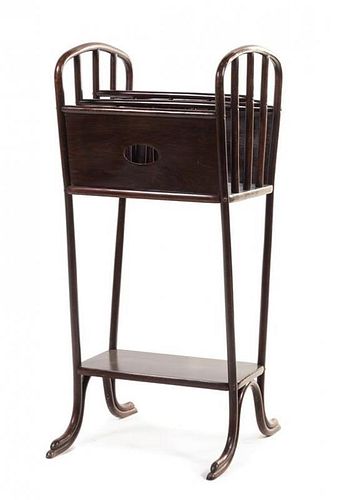 * Thonet, AUSTRIA, EARLY 20TH CENTURY, a bentwood canterbury, having a slotted top over a medial shelf labeled to the undersi