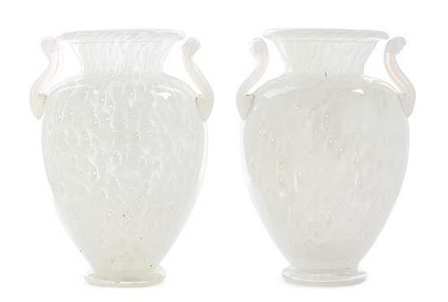 * Steuben, a pair of cluthra glass vases, each of baluster and handled form