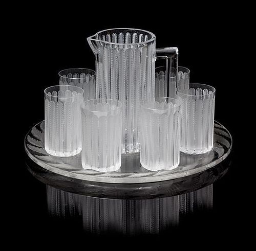 * Rene Lalique (French, 1860-1945), , a Jaffa drink set, comprising a pitcher, six tumblers and an associated circular tray
