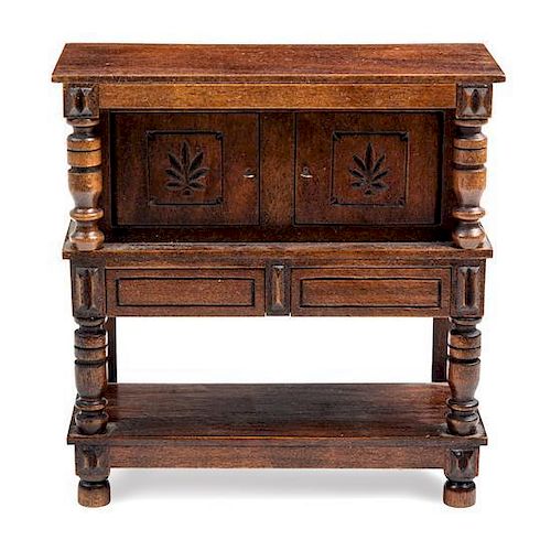 A Jacobean Style Court Cupboard Height 4 1/2 x width 4 3/8 x depth 1 7/8 inches.