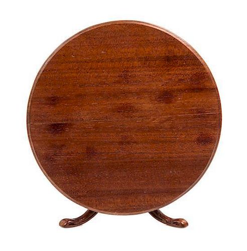 A Regency Style Mahogany Dining Table Height 2 3/8 x diameter 4 inches.