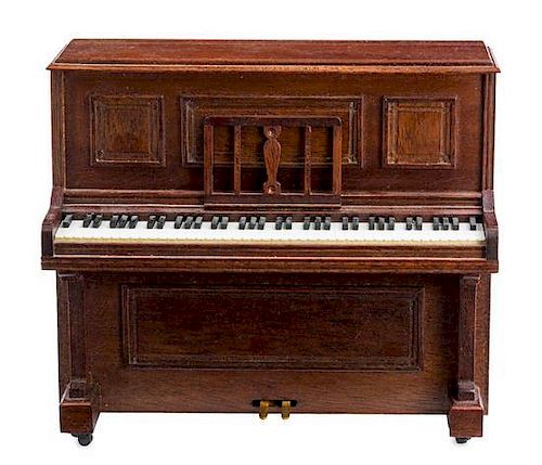 An Upright Piano Height 4 1/4 x width 4 7/8 x depth 1 7/8 inches.