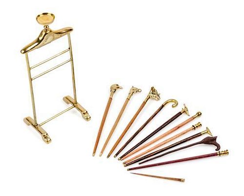 A Group of Eleven Canes and Walking Sticks Height of valet stand 3 3/8 inches.