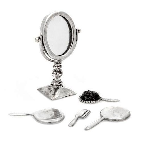 A Group of Five Silver Dresser Articles, , comprising a dresser mirror, two hand mirrors, a bristle brush and a comb.