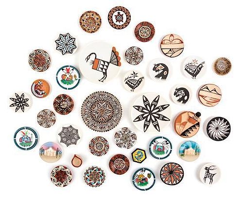A Collection of Native American Pottery Plates Diameter of largest 2 1/4 inches.