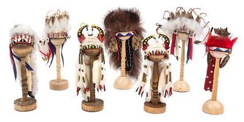 A Group of Seven Native American Style Headdresses Length of longest 4 1/4 inches.