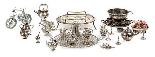 A Collection of Silver and Silvered Metal Table Articles Width of widest serving tray 3 1/2 inches.