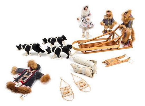 A Sled Dog Team Length of largest sled 9 1/8 inches.