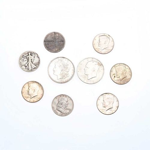 Cinco monedas Liberty en plata .720 y cuatro monedas Liberty de cuproniquel. Peso: 133.9 g. 9 pz