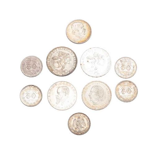 Dos monedas Olímpicas, 1 Carranza, 1 Juárez, 1 peso Morelos y 5 monedas de 50 centavos en plata ley .500 y .720. Peso: 136.6 g.