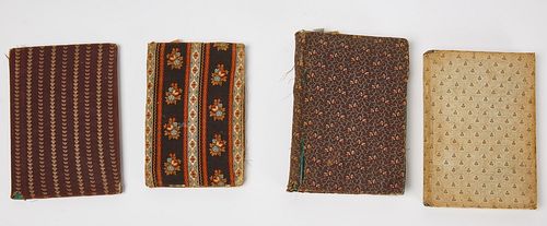 Group of Four Early Fabric Covered Books