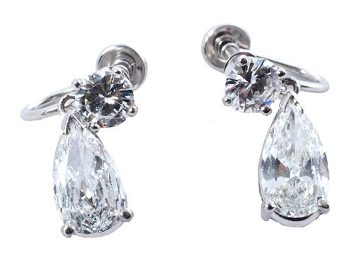Pair of  Pear Shaped And Brilliant Diamond Earrings Set In White Gold And Platinum