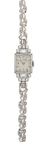 Movado 14kt Gold And Diamond Lady's Wrist Watch, H .75'' W .5''