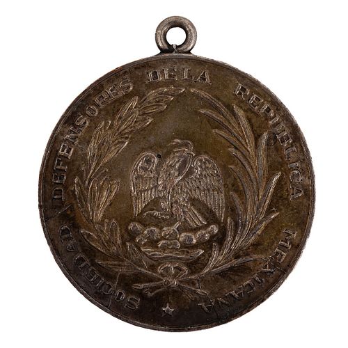 Sociedad de Defensores. Medalla. México: ca. 1880.  Medalla en bronce, 30 mm. - 10 gramos.