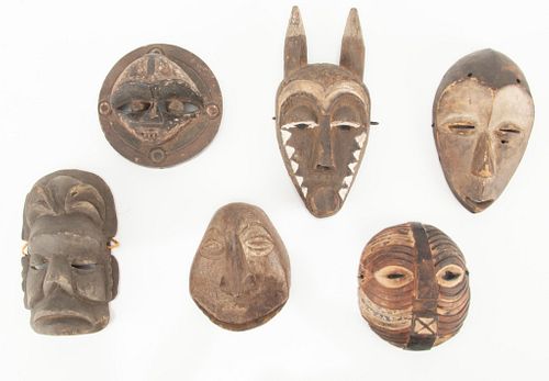 AFRICAN POLYCHROME CARVED WOOD MASKS 20TH CENTURY GROUP OF SIX, H 6-8" 