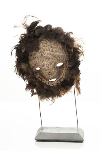 RETURN TO OWNER TEKE-TSAYE, DEMOCRATIC REPUBLIC OF THE CONGO, AFRICAN, CARVED WOOD KIDUMU MASK WITH SHELLS AND FEATHERS 20TH C. H 14" W 9" 