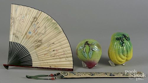 Pair of Chinese pottery fruit, together with a fan with an embroidered case.