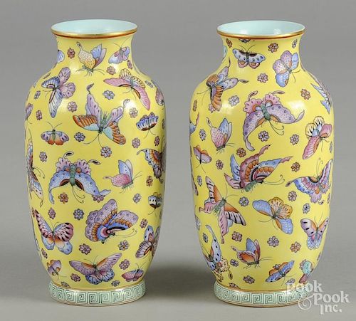 Pair of Chinese yellow ground porcelain vases, with Qianlong mark, but probably later, 8 1/4'' h.