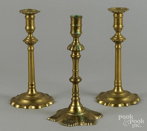 Three English brass candlesticks, mid 18th c.