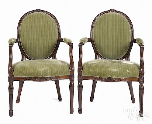Pair of George III carved mahogany dining chairs, late 18th c.