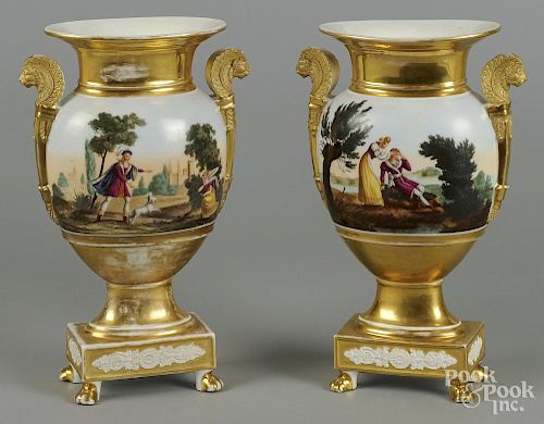 Pair of Paris porcelain painted urns, 19th c., 13 1/4'' h.