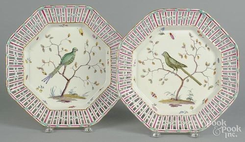 Pair of German reticulated porcelain chargers, with exotic bird decoration, 13'' dia.