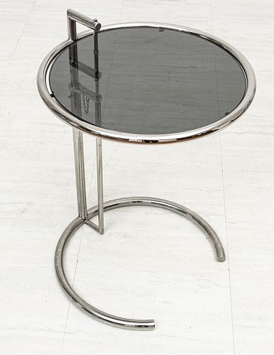 EILEEN GRAY CHROME AND GLASS ADJUSTABLE OCCASIONAL TABLE, 20TH C., H 24", DIA 20" 
