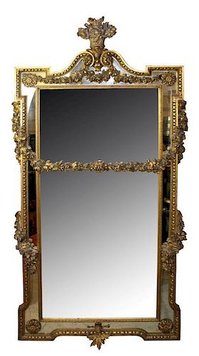 Italian Baroque gilt mirror with carved floral garland