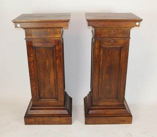 Pair of American oak exhibition pedestals