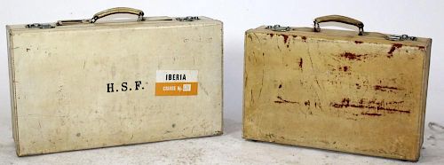 Lot of 2 vintage vellum wrapped suitcases