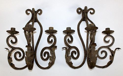 Pair of scrolled iron candle sconces