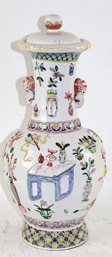 Glazed terra cotta lidded vase