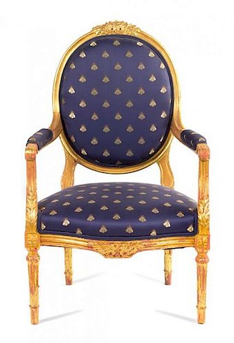 A Louis XVI Style Giltwood Bergere Height 39 inches.