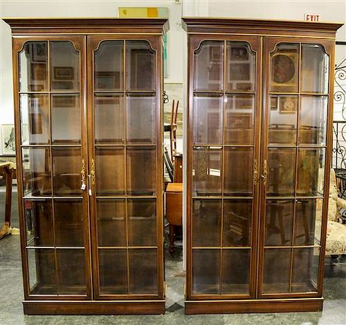 * A Pair of Parcel Gilt Vitrine Cabinets Height 85 x width 44 x depth 13 3/4 inches.