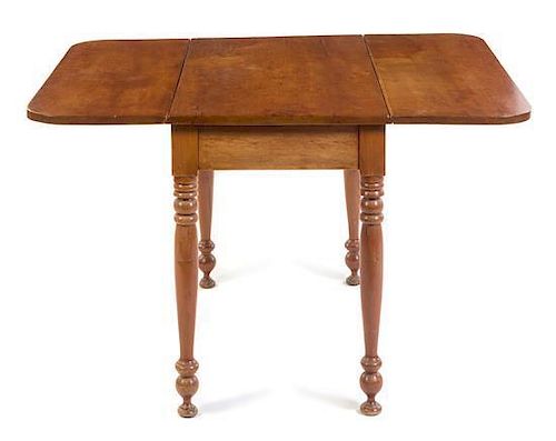 An American Maple Drop Leaf Table Height 28 1/2 x width 38 x depth 21 1/2 inches closed.