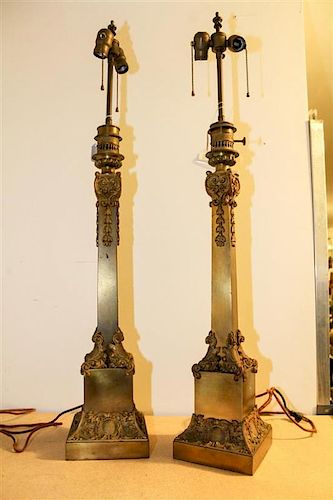 A Pair of French Brass Oil Lamps Height 38 3/4 inches.